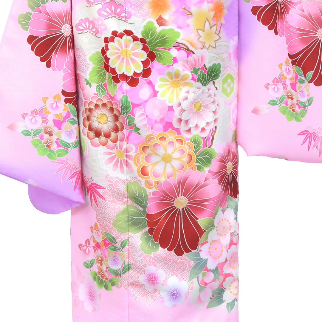 ピンクと紫地に花丸文の着物（アイボリー帯にグリーン）／七五三・七歳