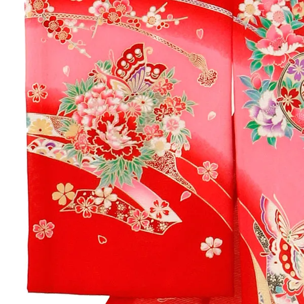 赤地に鼓と蝶の絽の祝い着（産着）／女児 左袖