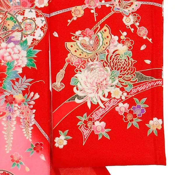 赤地に鼓と蝶の絽の祝い着（産着）／女児 右袖